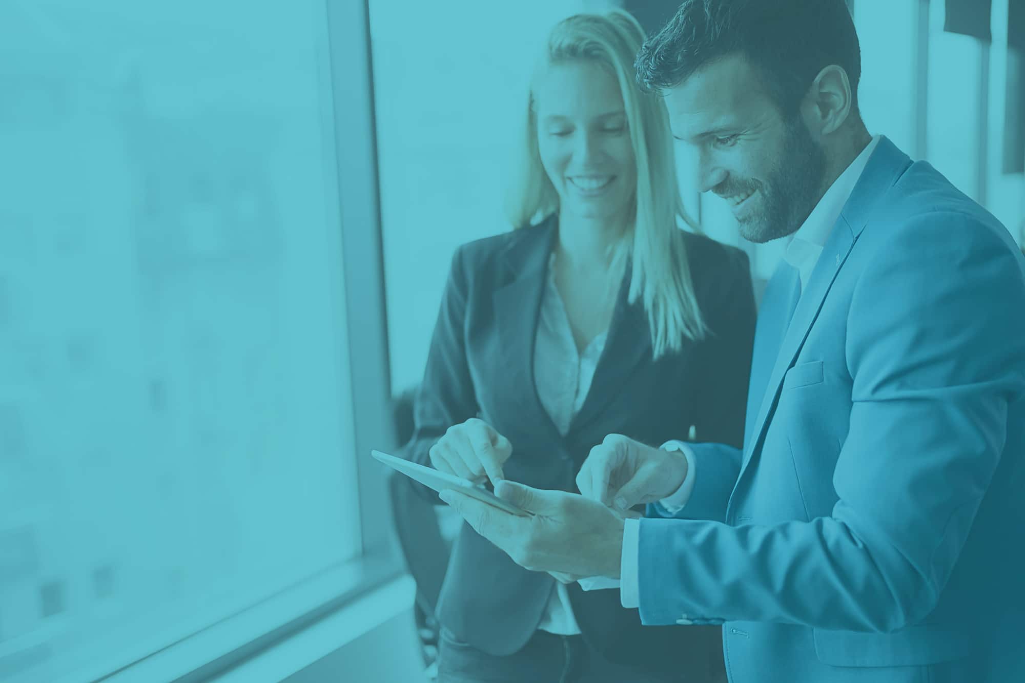 Happy,Business,Colleagues,In,Modern,Office,Using,Tablet