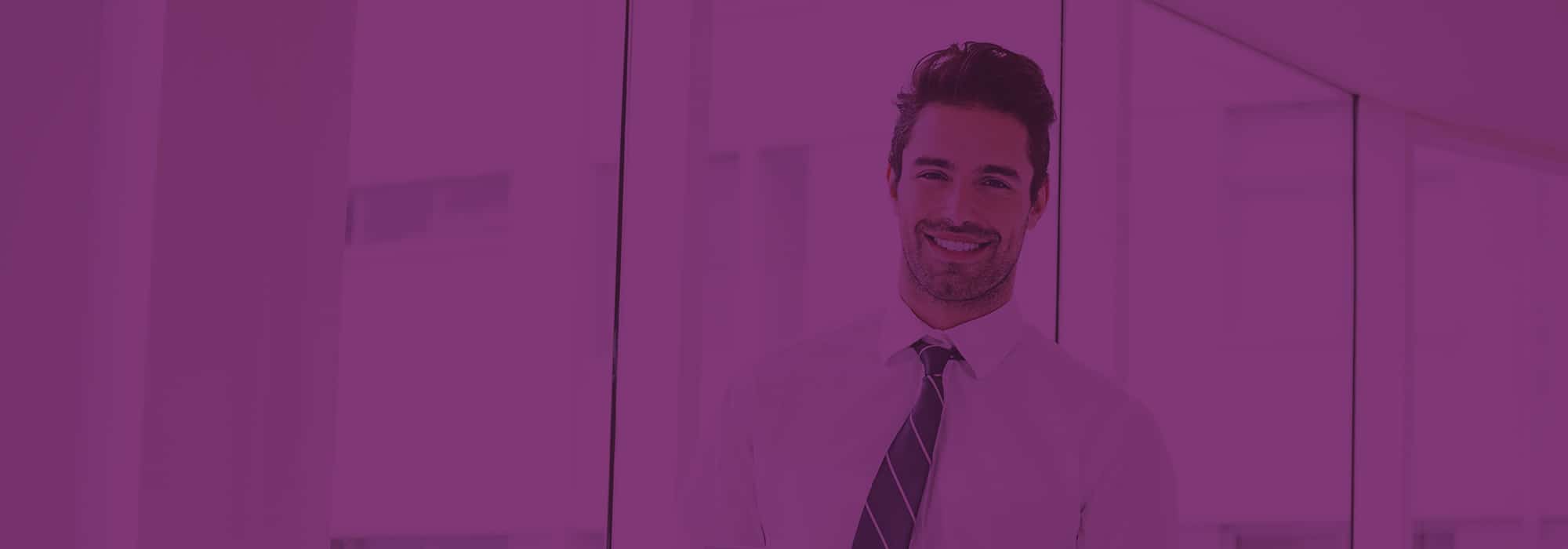 A,Man,Is,Holding,A,Notebook,And,Smiling,At,Office